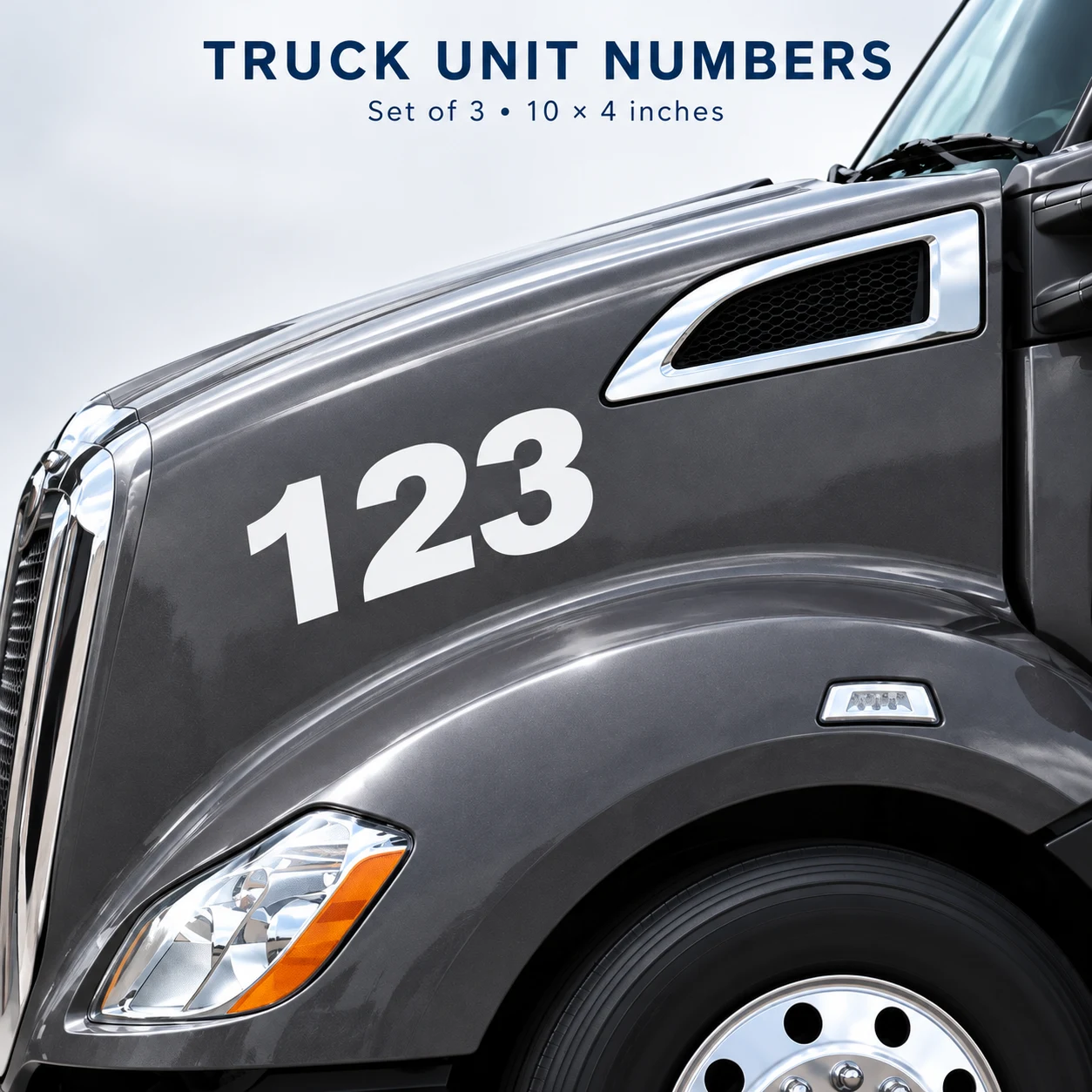 Modern white cut vinyl truck unit number 123 installed on a charcoal semi truck
